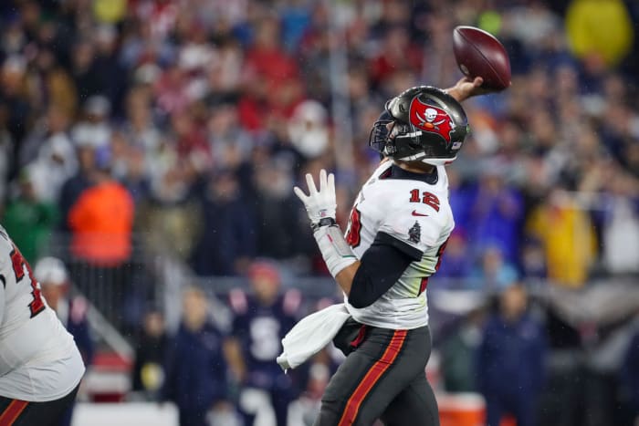 Oct 3, 2021; Foxboro, MA, USA; Tampa Bay Buccaneers quarterback Tom Brady (12) passes against the New England Patriots during the second half at Gillette Stadium. Mandatory Credit: Paul Rutherford-USA TODAY Sports